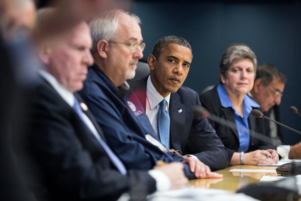 United States President Barack Obama listens to Transportation Secretary Ray LaHood speak during a briefing on the response to Hurricane Sandy at FEMA headquarters in Washington, D.C. October 31, 2012 (Pete Souza/Wikimedia Commons)