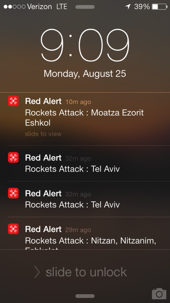 A screenshot of the author’s iPhone lock screen with notifications from Red Alert, August 25, 2014 (Alessandro Marazzi Sassoon).  