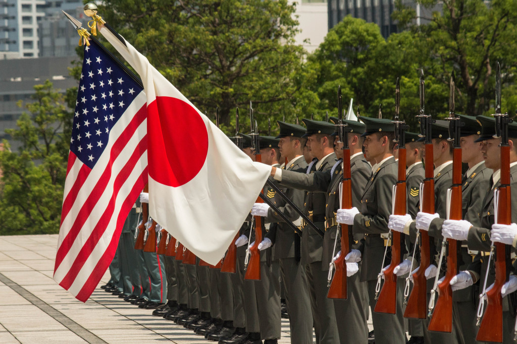 Japanese Ground Defense Force troops greet new commander of US Army forces in Japan in a ceremony at Yokota Air Base. July 2015. (Sgt. John L. Carkeet IV, U.S. Army Japan / Flickr Commons)