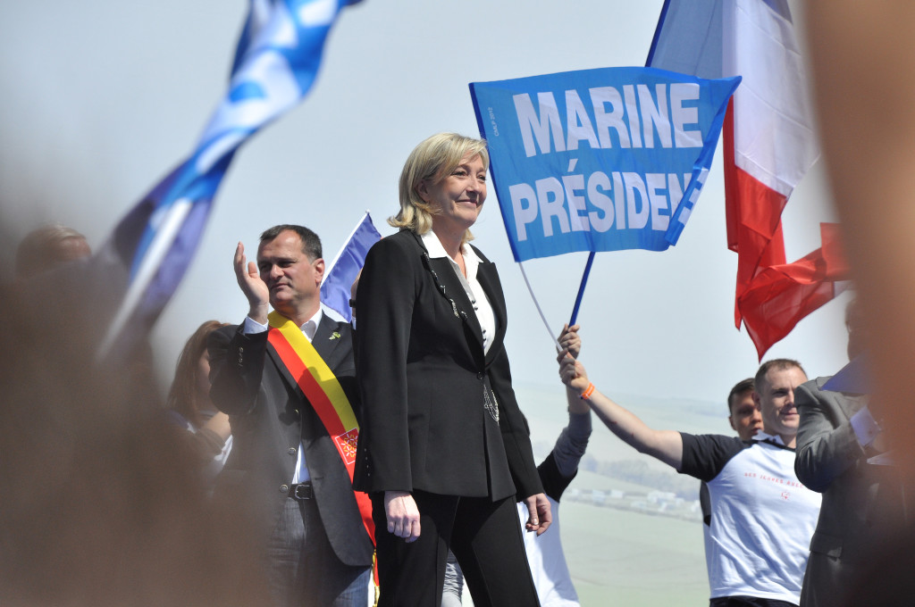 A fan expresses his support for Le Pen’s bid for presidency at a 2012 Front National meeting. (Blandine Le Cain/Flickr)