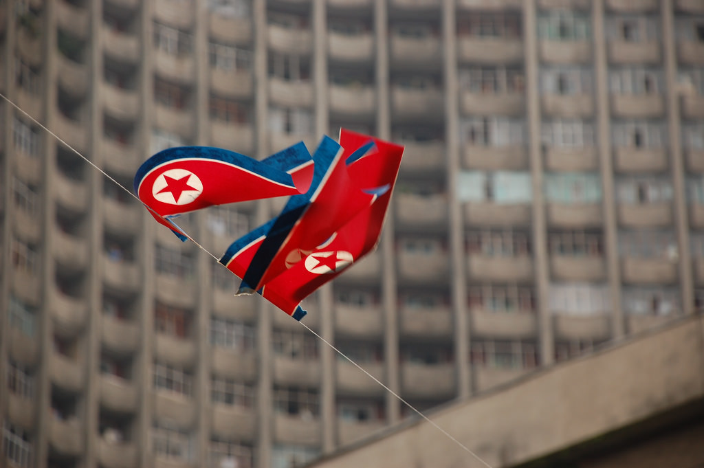 The North Korean flag flying over the nation’s capital. (Stephan, North Korea – Pyongyang/Flickr Commons). 
