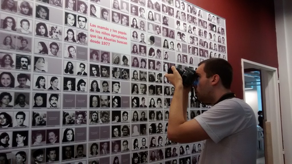 A man photographs a list of Argentine "desaparecidos" (Wikimedia Commons)